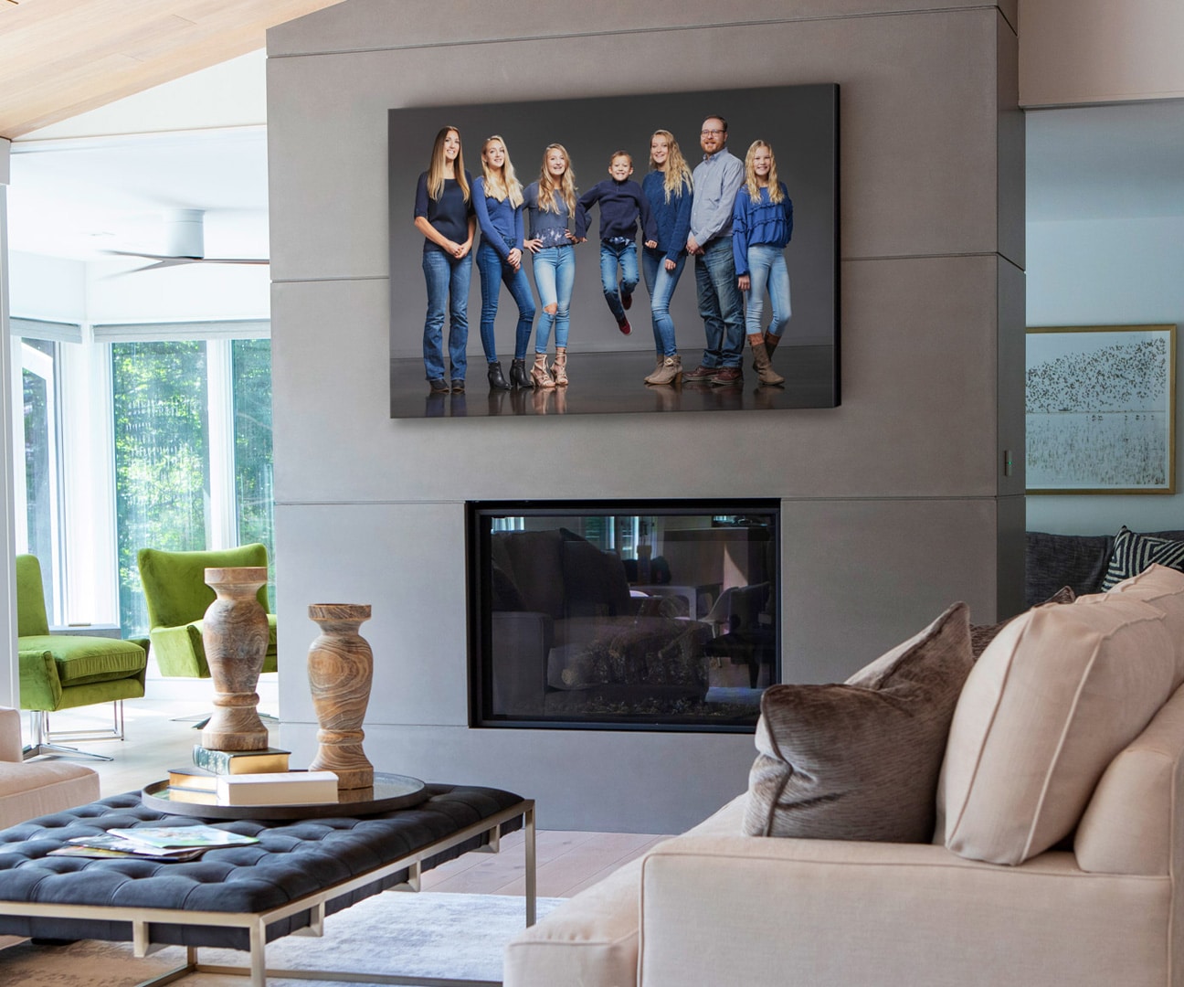 Beautiful Family Portrait above a modern fireplace in a designer living room
