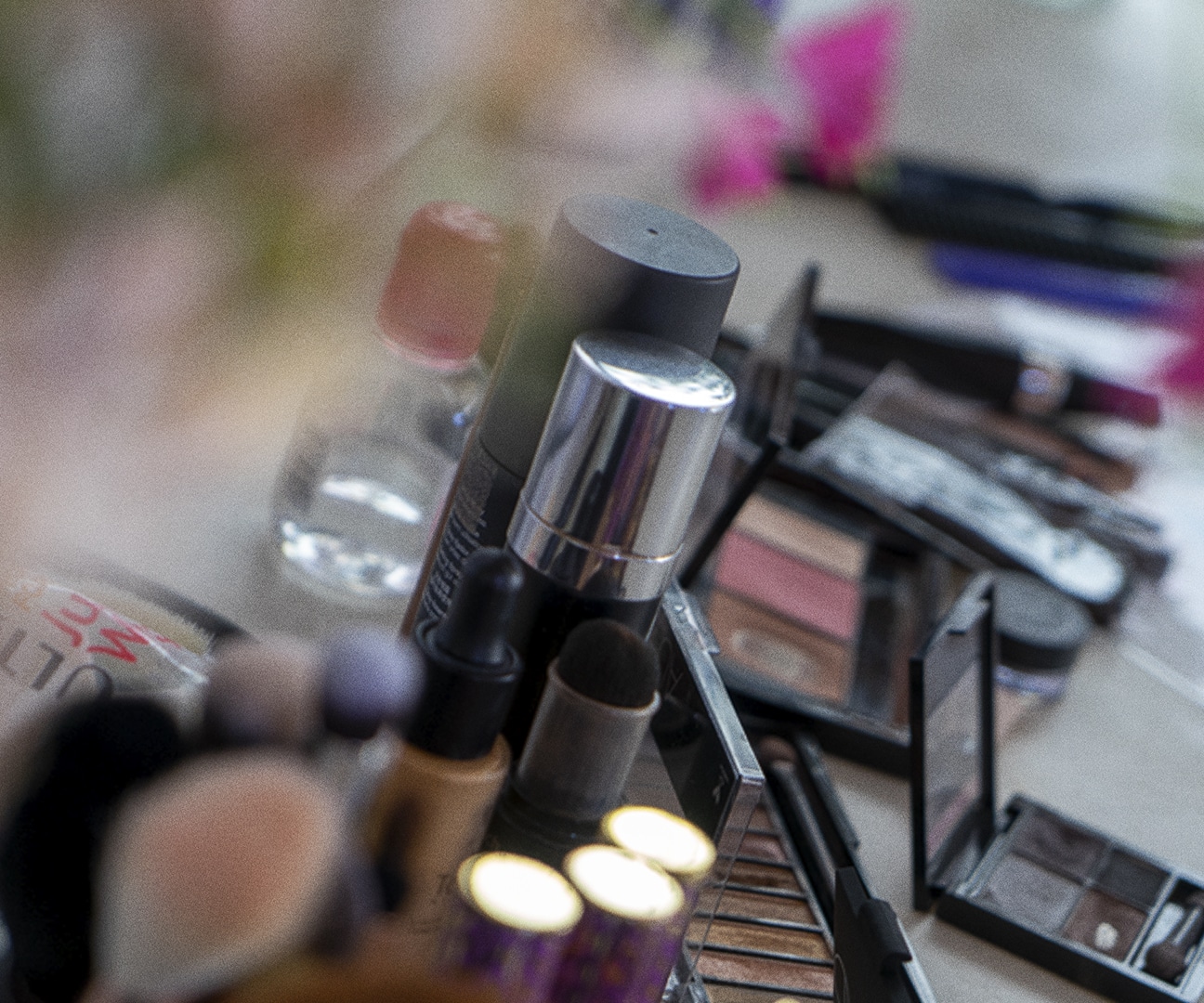 behind the scenes photo of makeup on a makeup table